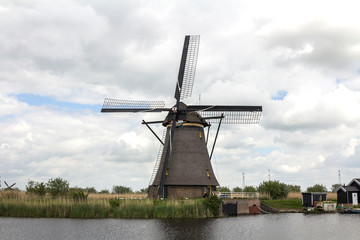 Netherlands rural lanscape with windmills at famous tourist site Kinderdijk, Rotterdam, in Holland. Old Dutch village Kinderdijk, UNESCO world heritage site.