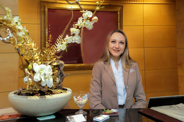 the administrator greets visitors with a smile