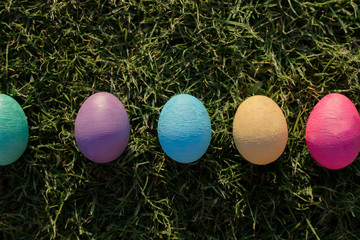 Fototapeta na wymiar easter eggs on green grass lined
