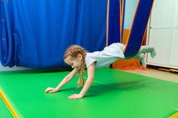 little girl in hammock sensory integration  - obrazy, fototapety, plakaty