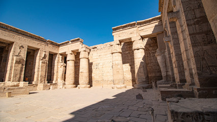 Obraz premium Temple of Medinet Habu. Egypt, Luxor. The Mortuary Temple of Ramesses III at Medinet Habu is an important New Kingdom period structure in the West Bank of Luxor in Egypt.