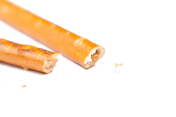 Salty cracker pretzel sticks isolated on white background.Copy space