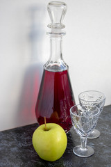 Cups of red wine still life with a bottle of red wine