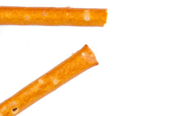 Salty cracker pretzel sticks isolated on white background.Copy space