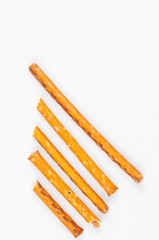 Salty cracker pretzel sticks isolated on white background.Copy space