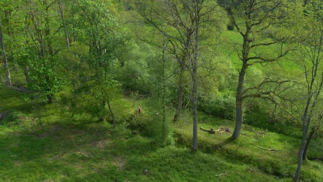 aerial of mountain bikers cycling along a trail