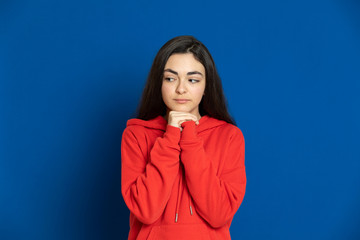 Obraz premium Brunette young girl with a red jersey
