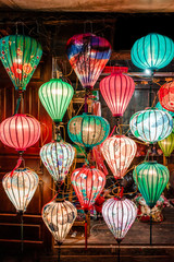 Traditional colorful lanterns spread light on the old street of Hoi An Ancient Town - UNESCO World Heritage Site. Vietnam in 2019.