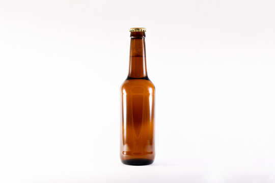 Full brown Beer Bottle Mock-up on white background.High resolution photo