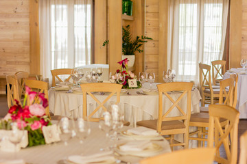 Empty banquet hall. Served tables. Tables for guests. Cafe. Waiting for guests.
