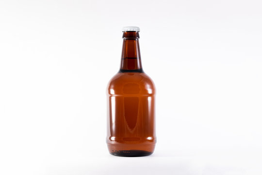Full brown Beer Bottle Mock-up on white background.High resolution photo