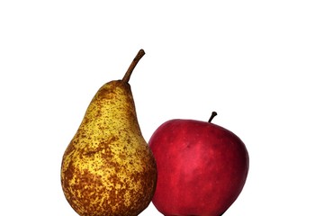 An apple and a pear next to each other infront of  white area. Comparing an apple to a pear.