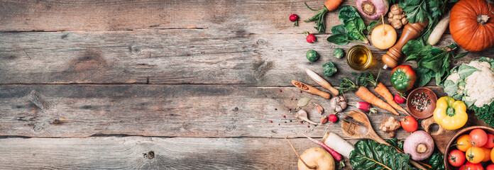 Fresh ingredients for healthy cooking or salad making on wooden background. Top view. Copy space....