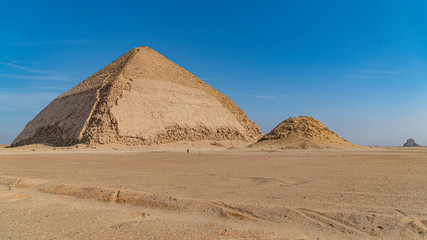 The Bent Pyramid is an ancient Egyptian pyramid located at the royal necropolis of Dahshur,...