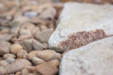 Large beige pebbles and pieces of Sandstone, background image