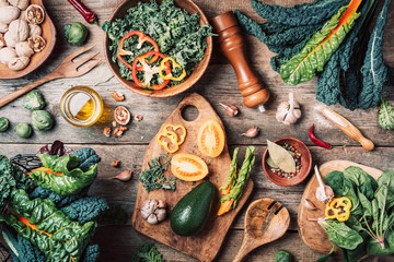 Orgnic healthy vegan food cooking ingredients. Top view. Copy space. Green vegetables, seeds,...