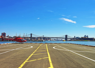 Red Helicopter on helipad in Lower Manhattan of New York
