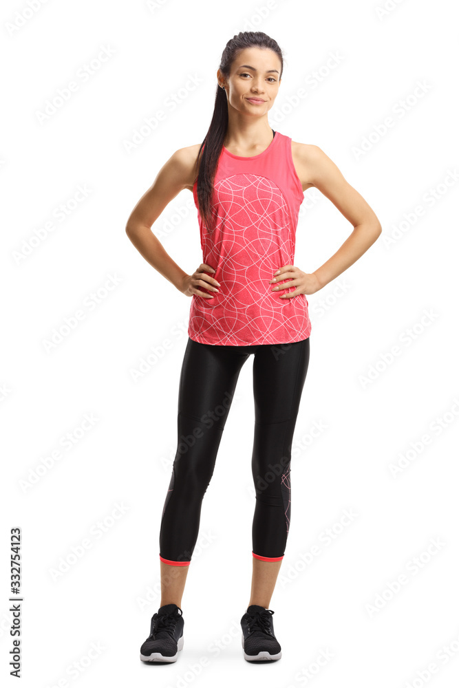 Wall mural Young slim female in sportswear