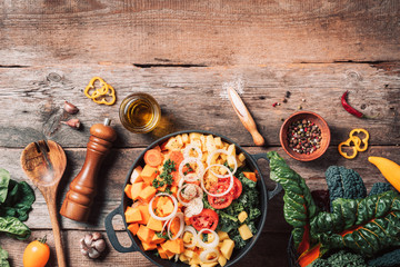 Organic vegetarian ingredients and kitchen tools. Healthy, clean food and eating concept. Top view. Copy space. Ingredients for cooking on wooden table. Vegan diet concept with copyspace. Zero waste