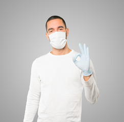 Coronavirus.Young man doing concepts and wearing mask and protective gloves