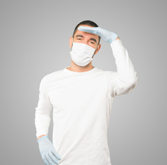 Coronavirus.Young man doing concepts and wearing mask and protective gloves