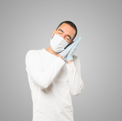 Coronavirus.Young man doing concepts and wearing mask and protective gloves