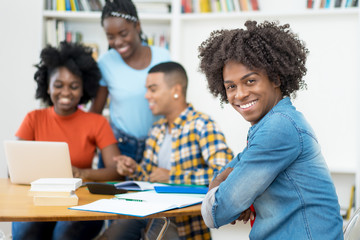 African american computer science student with group of students