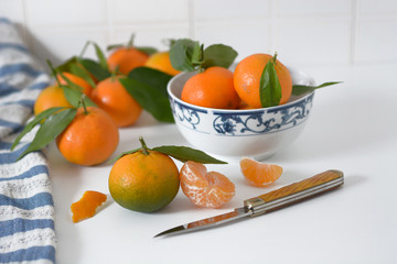pile of tangerines on the kitchen table