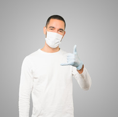 Coronavirus.Young man doing concepts and wearing mask and protective gloves