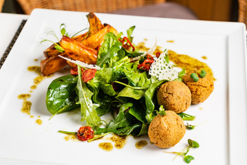 delicious falafel with salad and potatoes