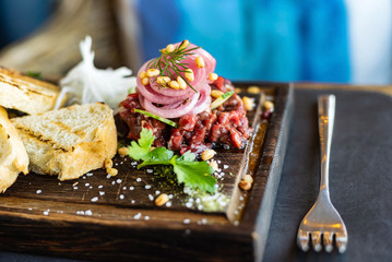 beef tartare on the wooden tray