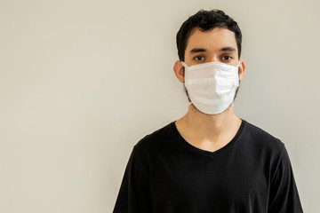Man wearing protection face against coronavirus. Medical surgical mask. Novel coronavirus. (2019-nCoV). Covid-19.