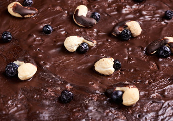texture of baked brownie chocolate cake with chocolate poured. Cooked homemade food