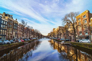 Obraz premium Beautiful view of Amsterdam canal at spring day. Amsterdam is capital of Netherlands. Old town.