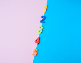 multi-colored plastic children`s figures on a colored background