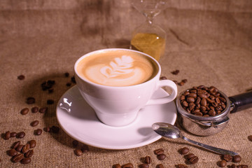 Tasty fragrant caupchino on a canvas background. Near the Turk and the holder.