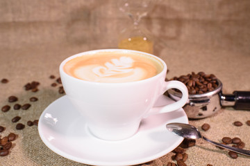 Tasty fragrant caupchino on a canvas background. Near the Turk and the holder.
