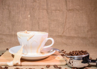 Splash from a cup with a coffee drink. Beautiful background.