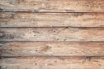 Backgroud of aged rounded natural wood fence texture. Horizontal arrangement of boards