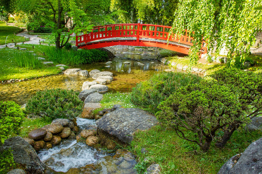 Red bridge  and  water in japanese garden
