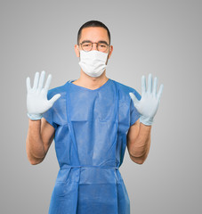 Coronavirus.Young man doing concepts and wearing mask and protective gloves