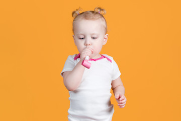 Little girl about to blow a festive whistle