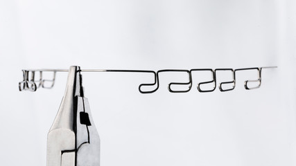 special orthodontic arch with arcs and tool on a white background