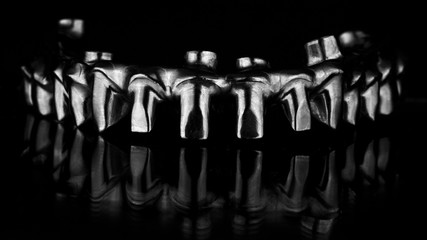 Fototapeta premium high-quality dental titanium beam with reflection on a black background