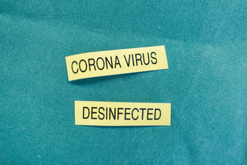 on  green cloth is the word Corona virus and vaccination