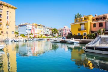 Fototapeta na wymiar Port Sa Playa, Valencia, Spain - 3/19/2019: Bright sunny day photo looking at Port Saplaya, Valencia's Little Venice