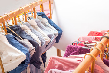 Lot of different clothes on hangers. Copy space