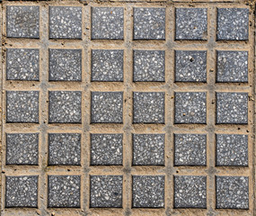 Sidewalk background. Gray squared tiles. Seamless texture. Top view.