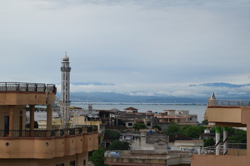 Fototapeta na wymiar City view after rain with cloudy sky 