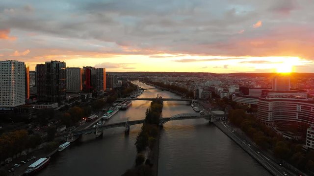 Aerial distant sunset view of Melia Paris La Defense Skyline buildings office and Seine River, Paris buildings rooftops, France 